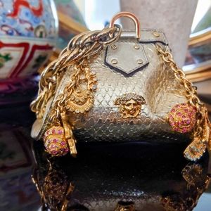 Vintage, Limited Edition Versace "fortune cookie" runway purse in metallic gold